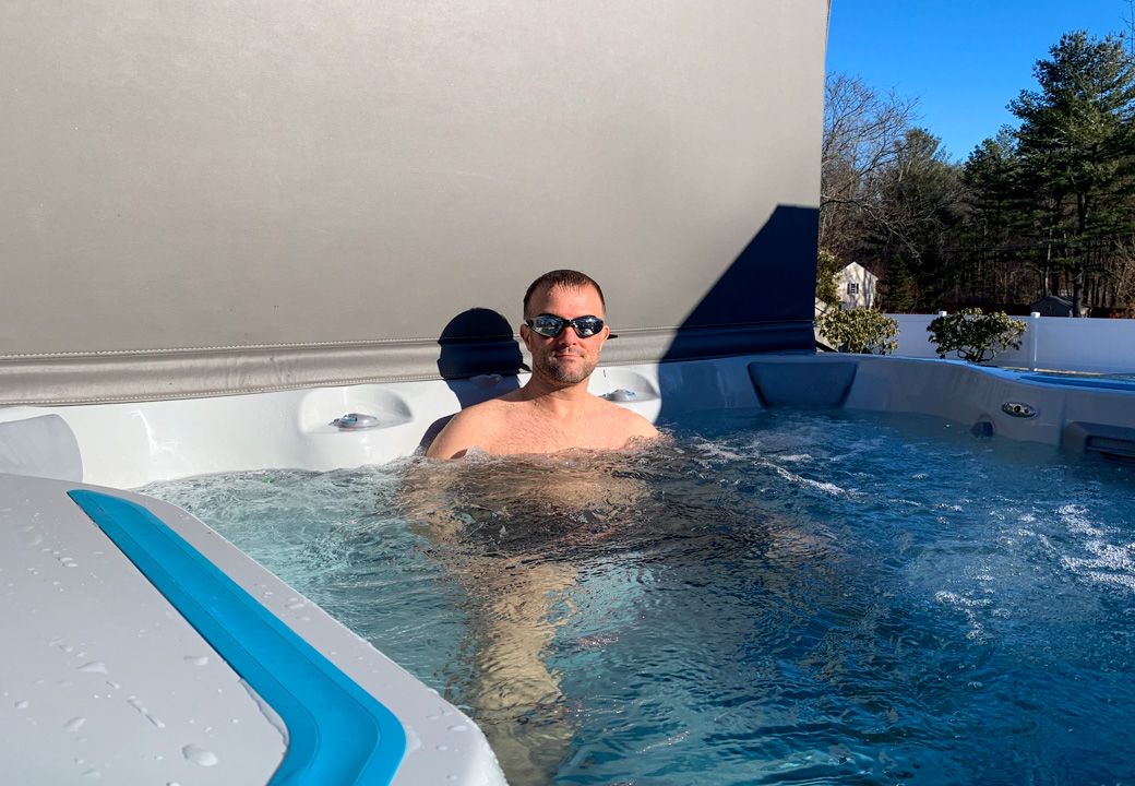 picture of man relaxing in Endless Pools E500 swim spa