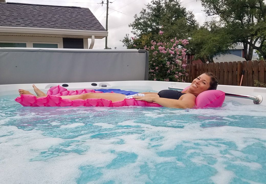 picture of woman floating in an Endless Pools X500 swim spa