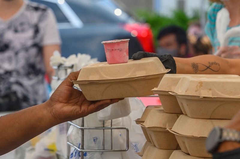 Serving food at Cathedral Kitchen