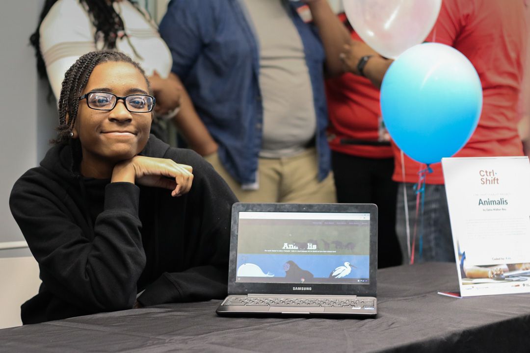 picture of girl with laptop at a Coded by Kids computer class