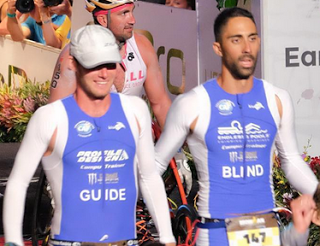 picture of IRONMAN triathlete Steve Walker crossing the finish line at Kona