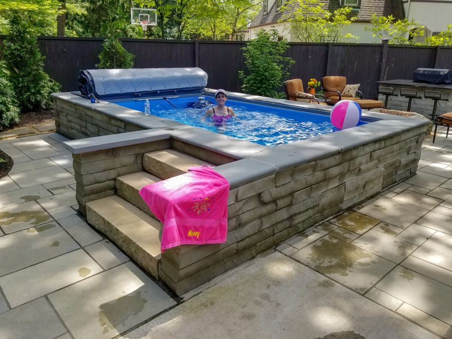 picture of woman in her Endless Pools Original model patio pool