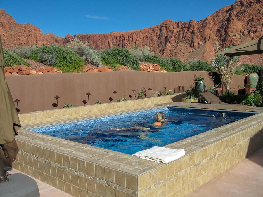 picture of swimmer in an Endless Pools Performance pool with a mountain view