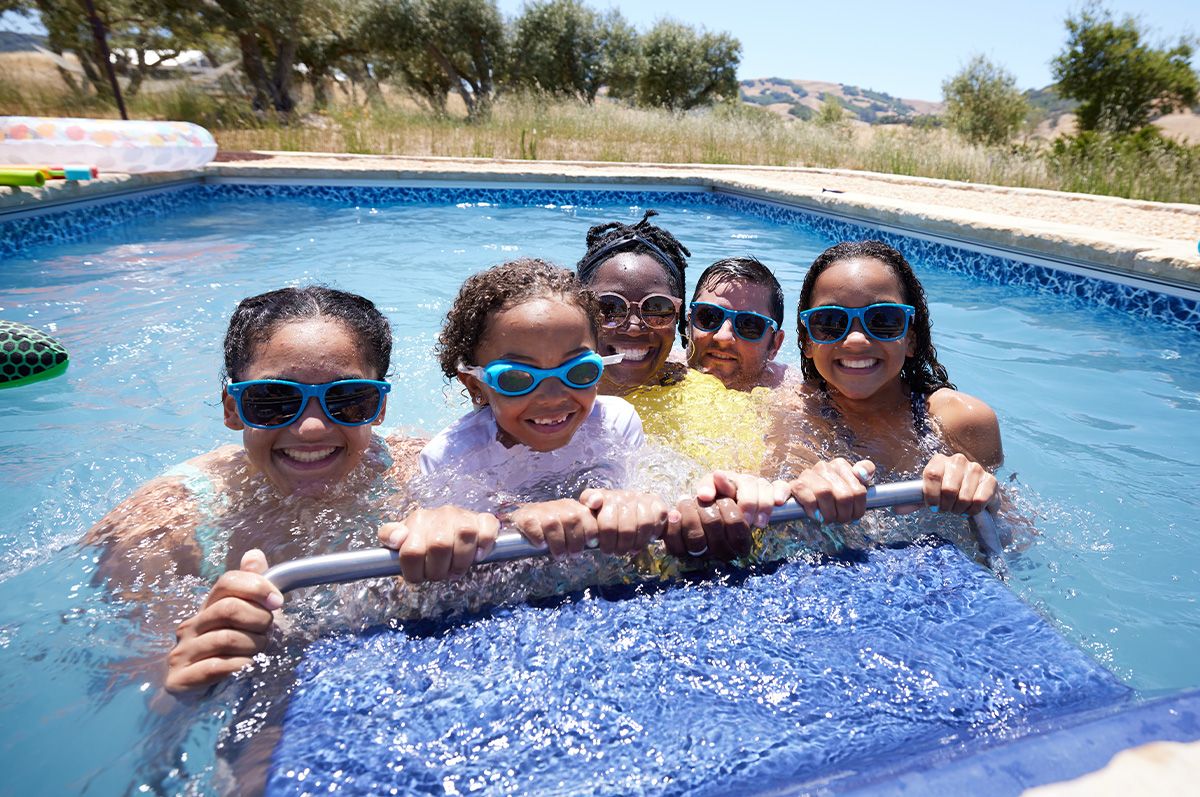 Family having fun in their backyard Original Series pool