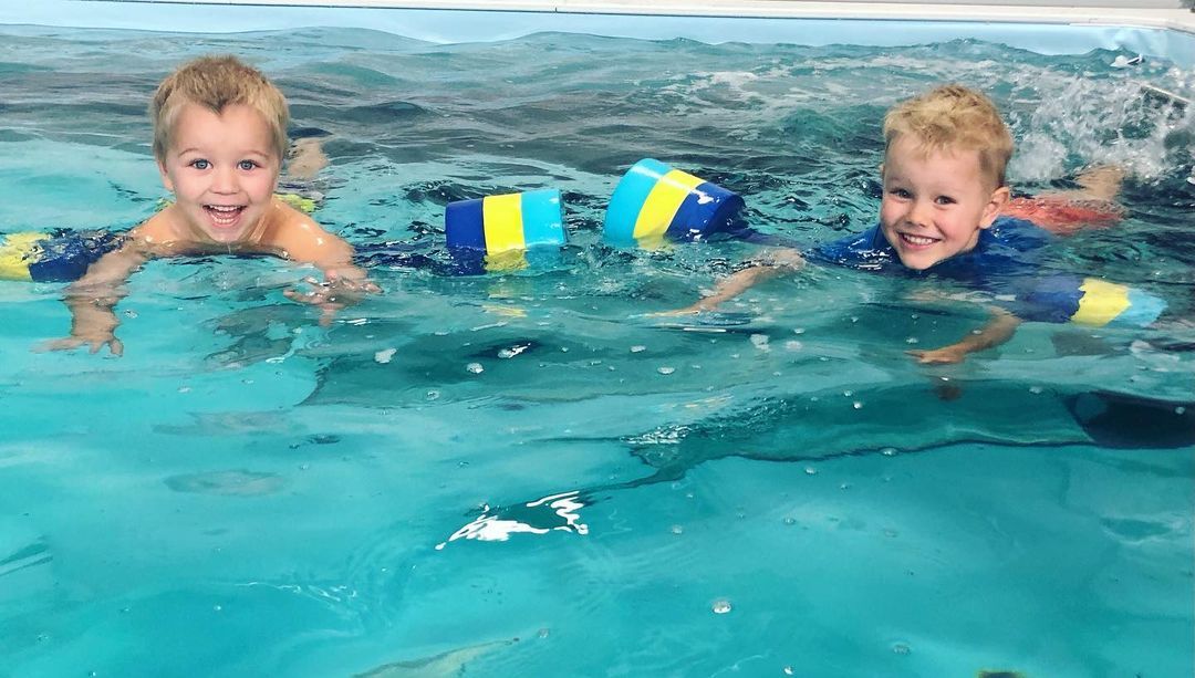 picture of twin brothers learning to swim in the Endless Pools Dual pool at Fast Track Swimming