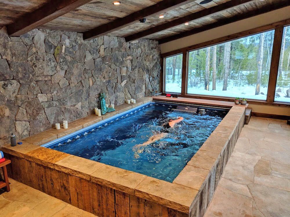 picture of a triathlete swimming in a Performance Endless Pool in a sunroom