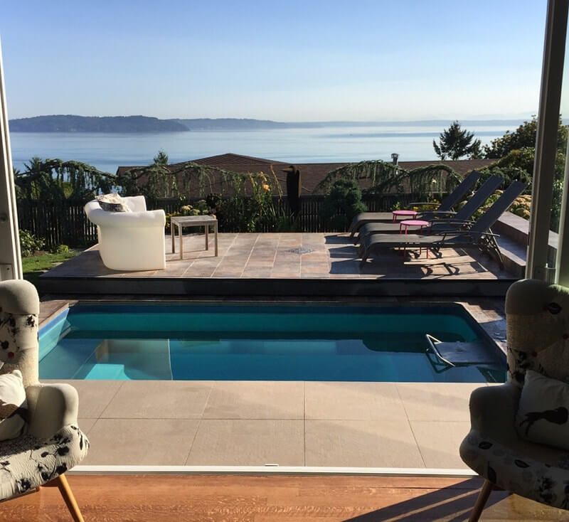 picture of a fully in-ground Endless Pools installation with an ocean view