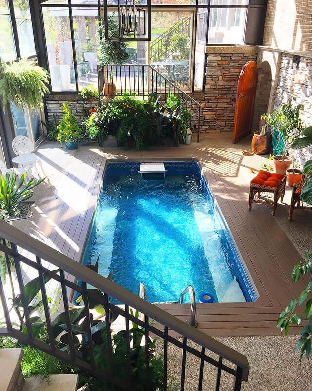 picture of a plant-filled sunroom pool from Endless Pools