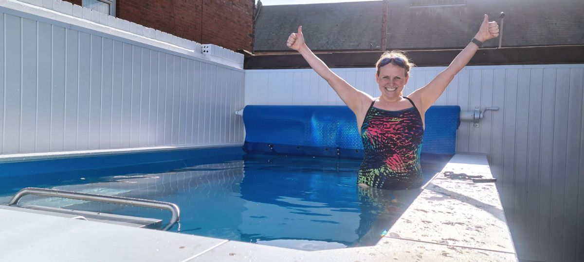 picture of swimming coach Lindsey in the Endless Pools backyard pool